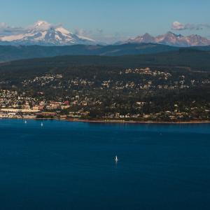 An aerial view of Western's campus, Mt baker and Bellingham bay